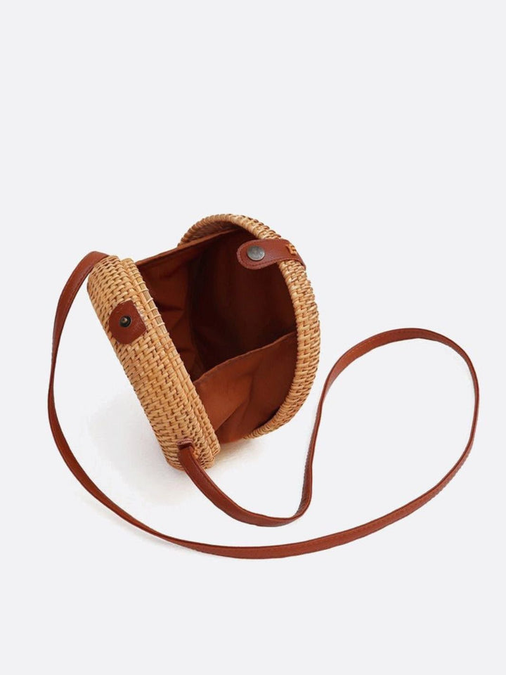 Round rattan bag with shoulder strap