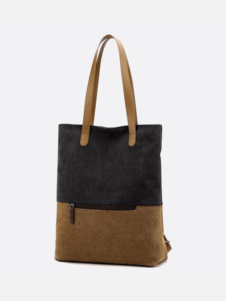 Sac noir toile porté épaule et dos